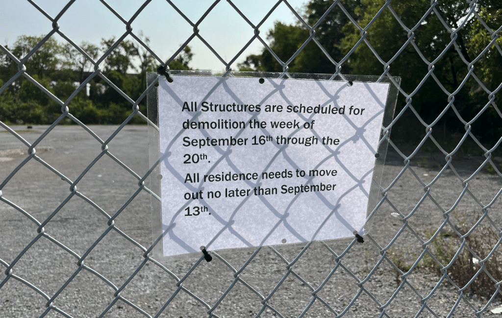 Signage placed around Old Tent City ordering clearing